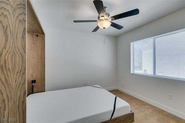 bedroom with baseboards, a ceiling fan, and carpet flooring