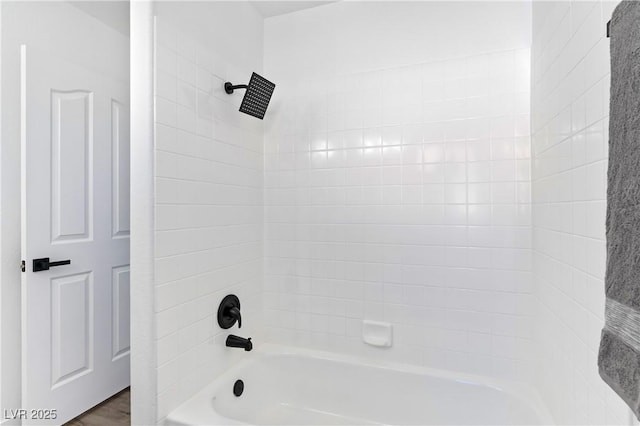 bathroom with wood finished floors and shower / bathing tub combination