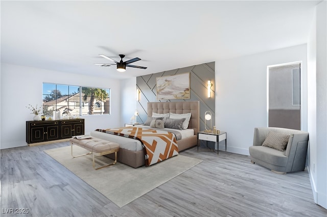 bedroom with baseboards, wood finished floors, and a ceiling fan