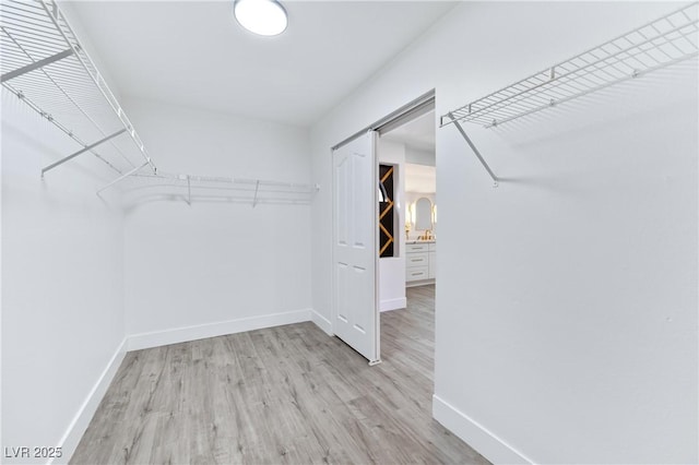 spacious closet with light wood-type flooring