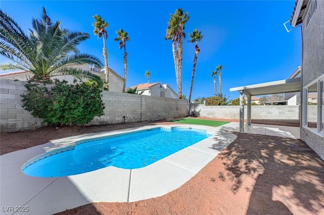 view of pool featuring a patio, a fenced in pool, and a fenced backyard