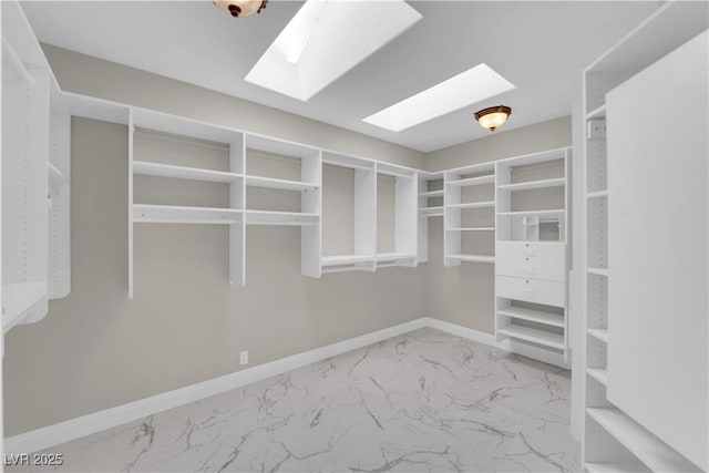 2595 Aviv Ct, Las Vegas, NV 89121 - walk in closet with marble look tile flooring and a skylight