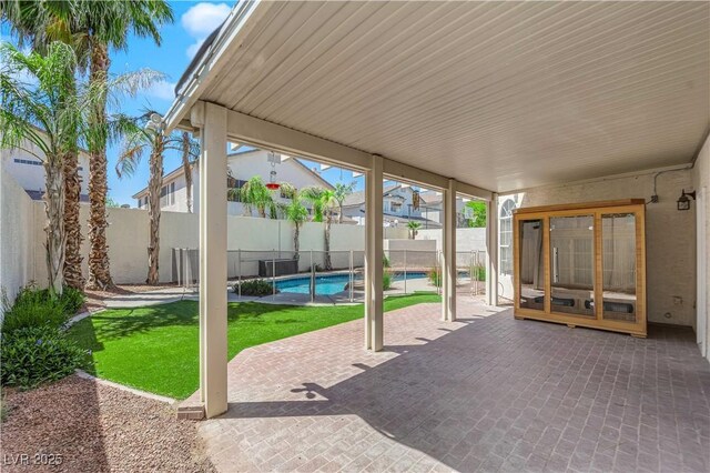 2595 Aviv Ct, Las Vegas, NV 89121 - view of patio with a fenced backyard and a fenced in pool