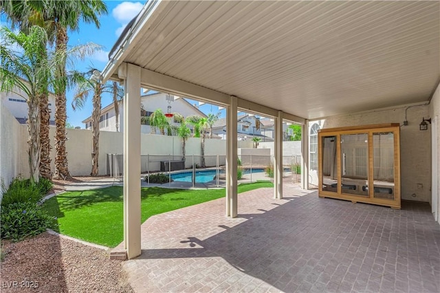 2595 Aviv Ct, Las Vegas, NV 89121 - fenced backyard with a patio