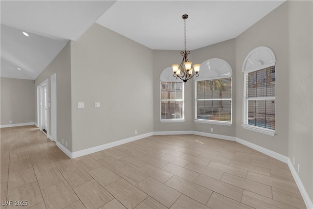 2595 Aviv Ct, Las Vegas, NV 89121 - spare room with baseboards, a healthy amount of sunlight, and an inviting chandelier