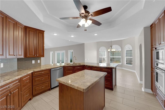 2595 Aviv Ct, Las Vegas, NV 89121 - kitchen with a sink, a raised ceiling, stainless steel appliances, recessed lighting, and a peninsula