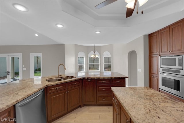 2595 Aviv Ct, Las Vegas, NV 89121 - kitchen with recessed lighting, a sink, a ceiling fan, light stone counters, and appliances with stainless steel finishes
