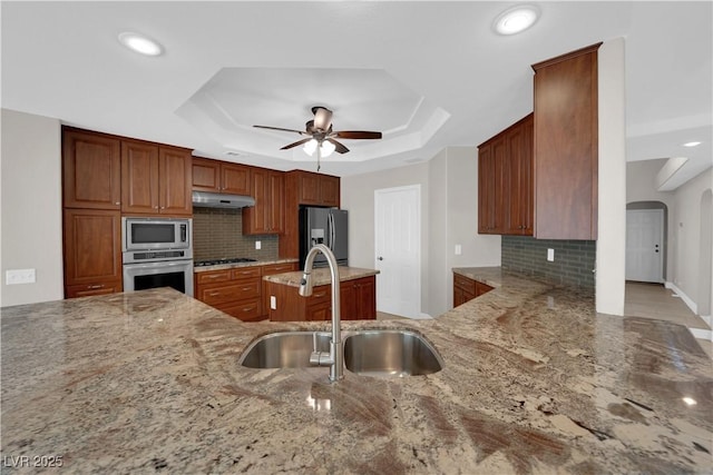 2595 Aviv Ct, Las Vegas, NV 89121 - kitchen featuring light stone counters, tasteful backsplash, a sink, appliances with stainless steel finishes, and ceiling fan