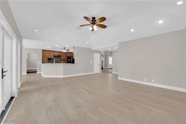 2595 Aviv Ct, Las Vegas, NV 89121 - unfurnished living room with recessed lighting, arched walkways, ceiling fan, and baseboards