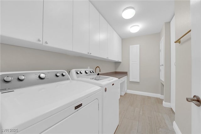 2595 Aviv Ct, Las Vegas, NV 89121 - laundry room with baseboards, cabinet space, and washer and clothes dryer