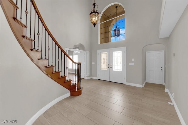 2595 Aviv Ct, Las Vegas, NV 89121 - entrance foyer with a chandelier, stairs, and a towering ceiling