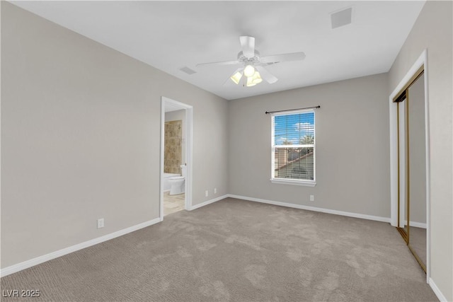 2595 Aviv Ct, Las Vegas, NV 89121 - unfurnished bedroom with carpet flooring, a closet, ensuite bathroom, and ceiling fan