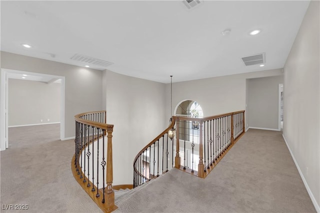 2595 Aviv Ct, Las Vegas, NV 89121 - hallway with carpet flooring, an upstairs landing, and visible vents