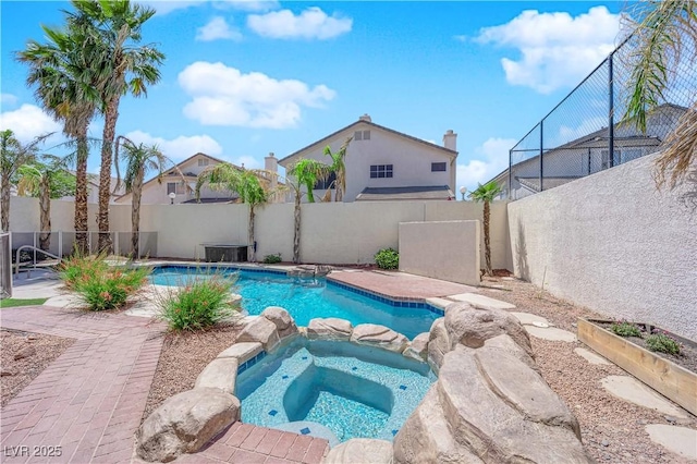 2595 Aviv Ct, Las Vegas, NV 89121 - view of pool featuring a fenced backyard and a pool with connected hot tub