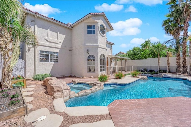 2595 Aviv Ct, Las Vegas, NV 89121 - view of pool featuring a patio, a pool with connected hot tub, and fence