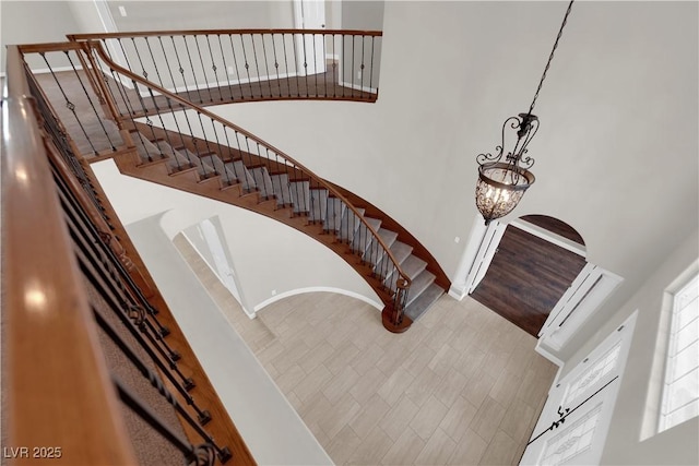 2595 Aviv Ct, Las Vegas, NV 89121 - stairway with an inviting chandelier and a high ceiling