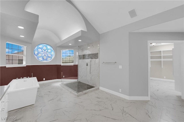 2595 Aviv Ct, Las Vegas, NV 89121 - full bathroom featuring a marble finish shower, a wainscoted wall, marble finish floor, a freestanding bath, and lofted ceiling