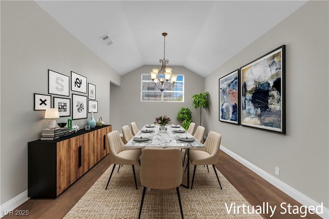 2595 Aviv Ct, Las Vegas, NV 89121 - dining area featuring a chandelier, vaulted ceiling, and dark wood-type flooring
