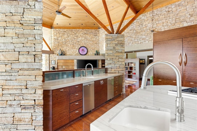 kitchen with wood ceiling, ceiling fan, stainless steel dishwasher, and a sink