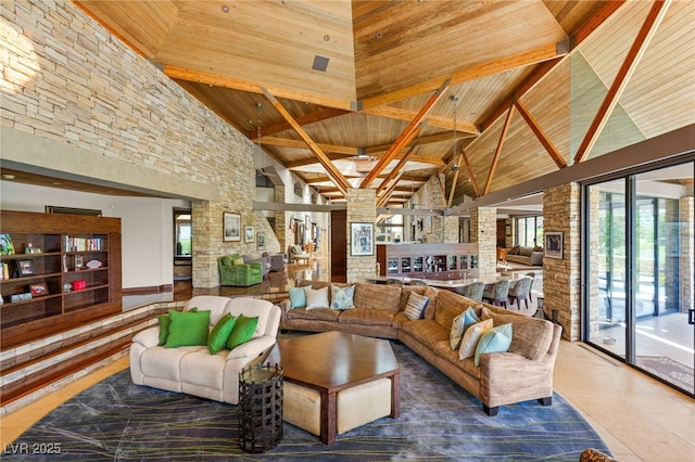living room featuring high vaulted ceiling, beamed ceiling, tile patterned flooring, and wooden ceiling
