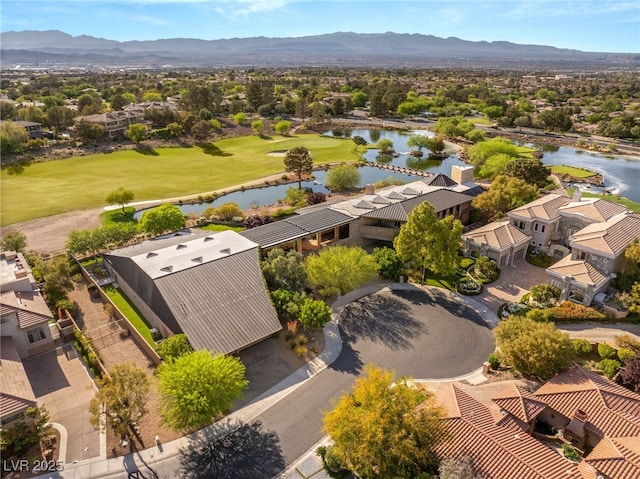 bird's eye view featuring golf course view, a residential view, and a water and mountain view