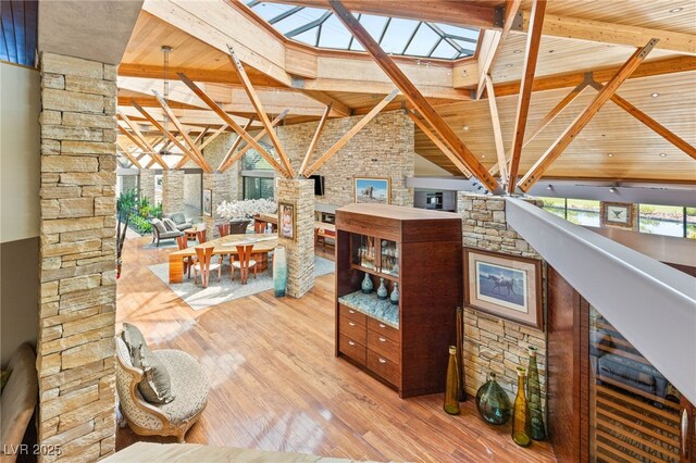 interior space with wood finished floors, vaulted ceiling with beams, and wood ceiling