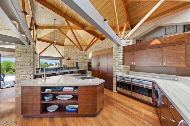 kitchen featuring a sink, wooden ceiling, open shelves, and stainless steel appliances