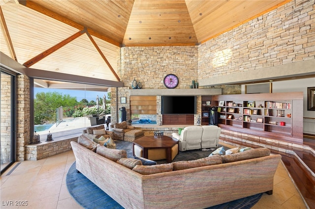 tiled living area featuring an outdoor stone fireplace, high vaulted ceiling, and wood ceiling