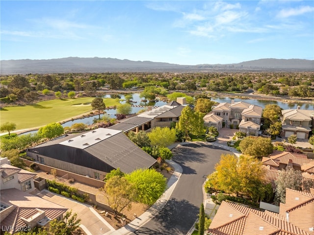 aerial view with a water and mountain view, a residential view, and view of golf course