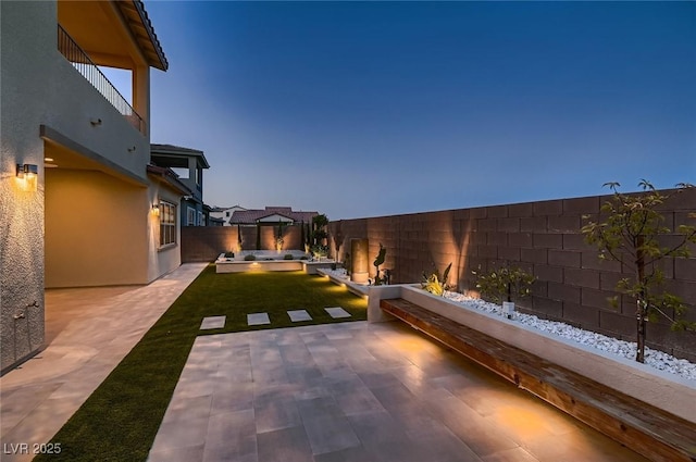 view of yard featuring a patio, an outdoor hangout area, and a fenced backyard