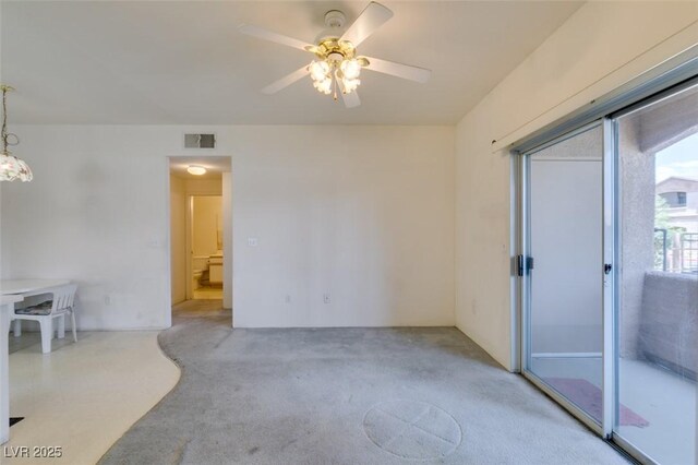 5751 E Hacienda Ave Unit 105, Las Vegas, NV 89122 - carpeted empty room featuring ceiling fan