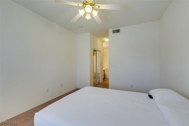 5751 E Hacienda Ave Unit 105, Las Vegas, NV 89122 - carpeted bedroom featuring a ceiling fan
