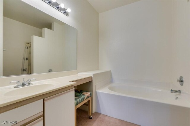 5751 E Hacienda Ave Unit 105, Las Vegas, NV 89122 - bathroom featuring a garden tub, vanity, and a shower
