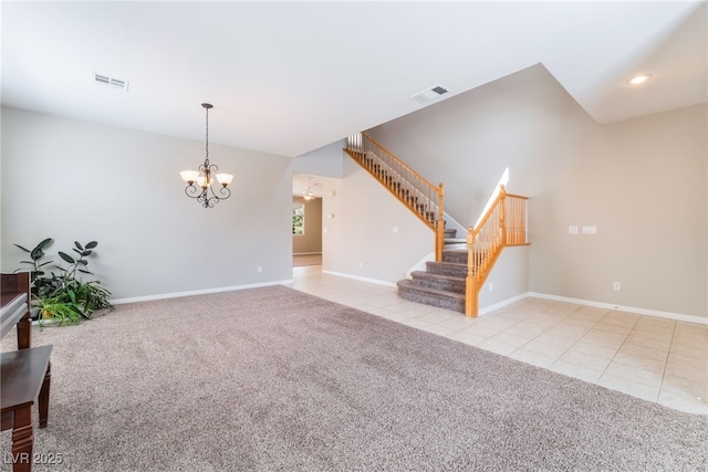 interior space featuring tile patterned floors, stairs, a chandelier, and visible vents