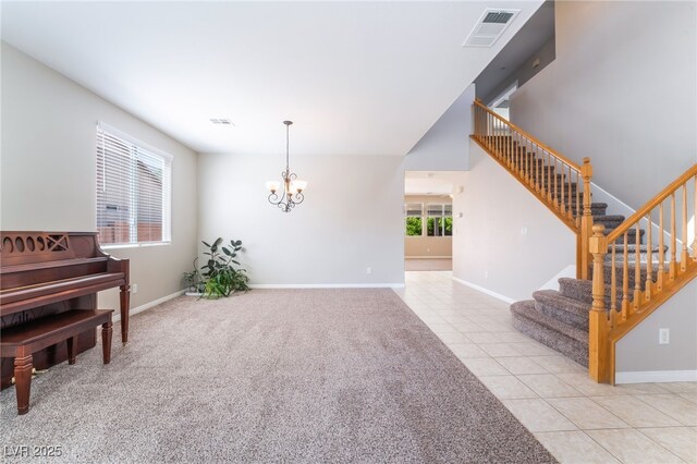 sitting room with visible vents, baseboards, an inviting chandelier, stairs, and light tile patterned flooring