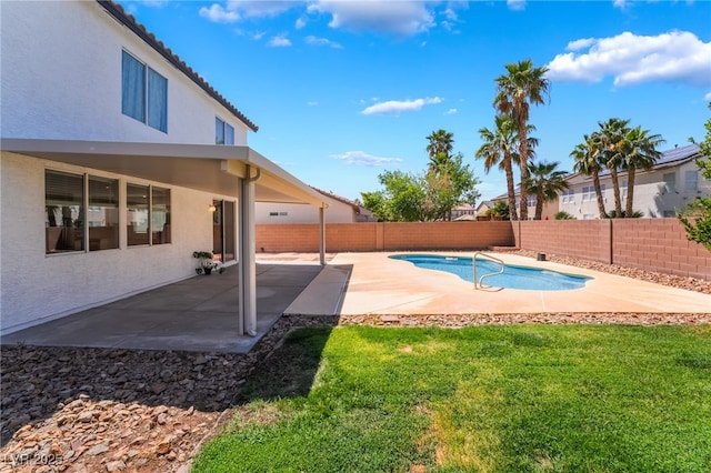 view of swimming pool featuring a fenced in pool, a fenced backyard, a patio area, and a yard