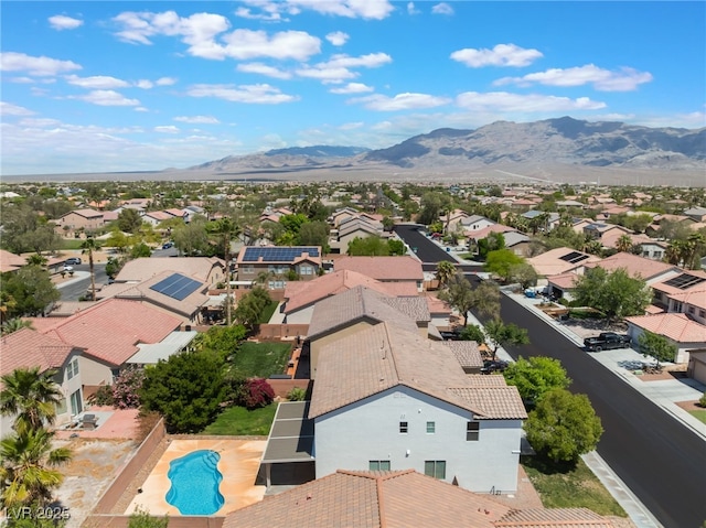 drone / aerial view with a residential view and a mountain view