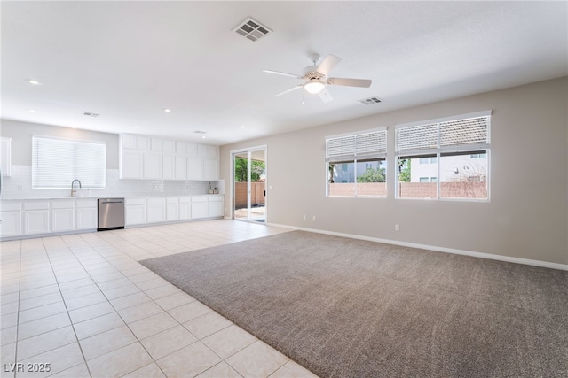 unfurnished living room featuring light tile patterned floors, a ceiling fan, recessed lighting, and visible vents