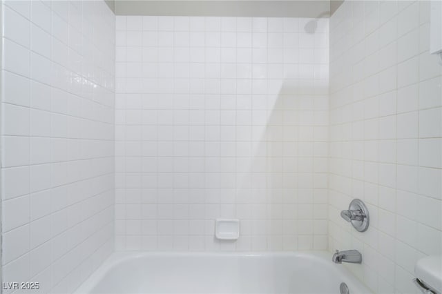 bathroom with shower / washtub combination