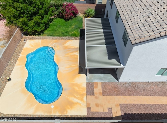 view of swimming pool with a fenced backyard, a fenced in pool, and a patio