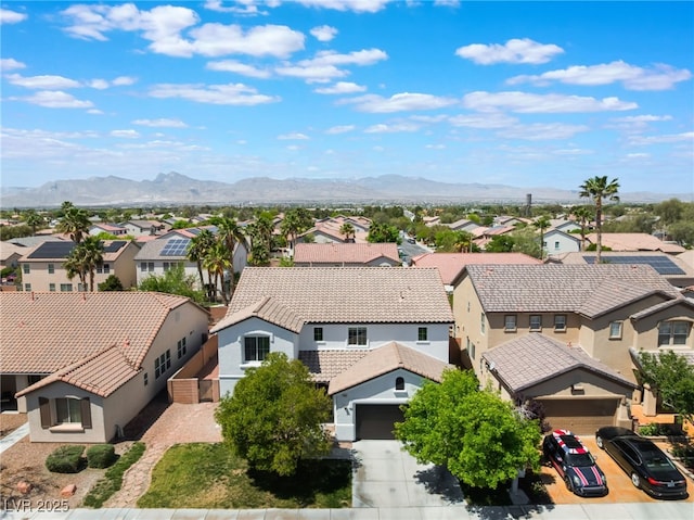 bird's eye view with a residential view and a mountain view