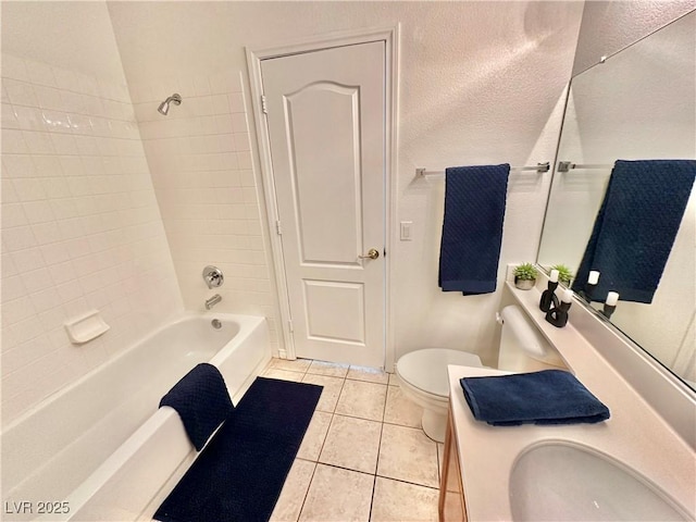 full bathroom featuring vanity, tile patterned floors, bathing tub / shower combination, and toilet