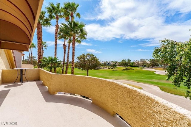 view of community with a lawn and view of golf course