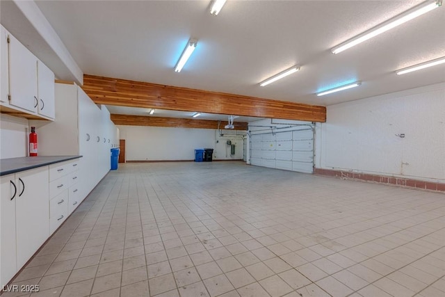 garage featuring baseboards
