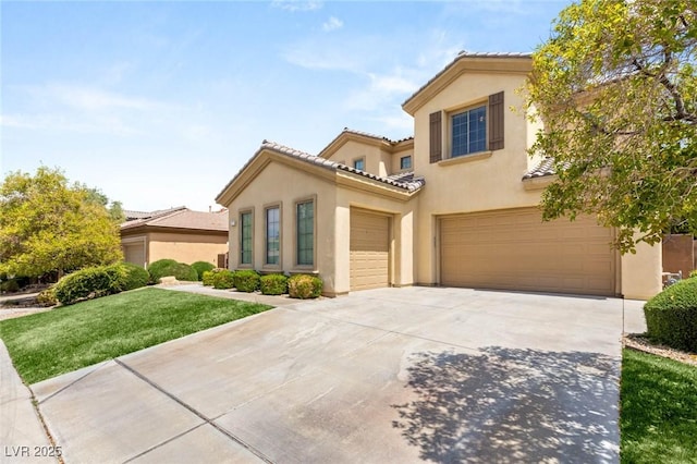 17 Morninglow Pass, Henderson, NV 89052 - mediterranean / spanish-style house featuring a tile roof, a front lawn, stucco siding, driveway, and an attached garage