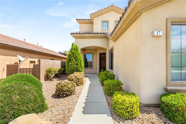 17 Morninglow Pass, Henderson, NV 89052 - entrance to property with a tile roof, stucco siding, and fence