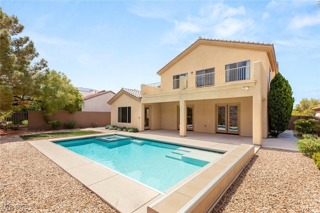 17 Morninglow Pass, Henderson, NV 89052 - back of house with a patio, a balcony, a fenced backyard, a tiled roof, and stucco siding
