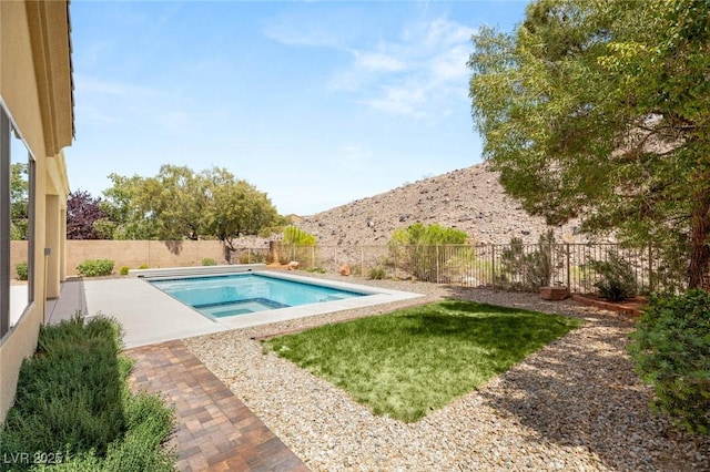 17 Morninglow Pass, Henderson, NV 89052 - view of pool with a patio, a fenced in pool, a fenced backyard, and a mountain view
