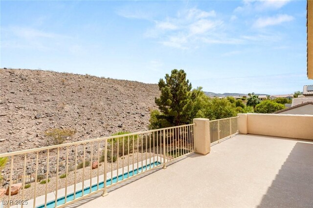 17 Morninglow Pass, Henderson, NV 89052 - view of patio featuring a balcony and a fenced in pool
