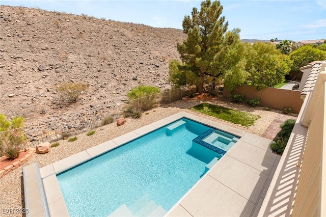 17 Morninglow Pass, Henderson, NV 89052 - view of pool featuring a pool with connected hot tub and a fenced backyard